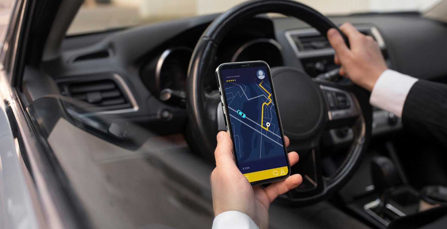driver checking his phone for directions