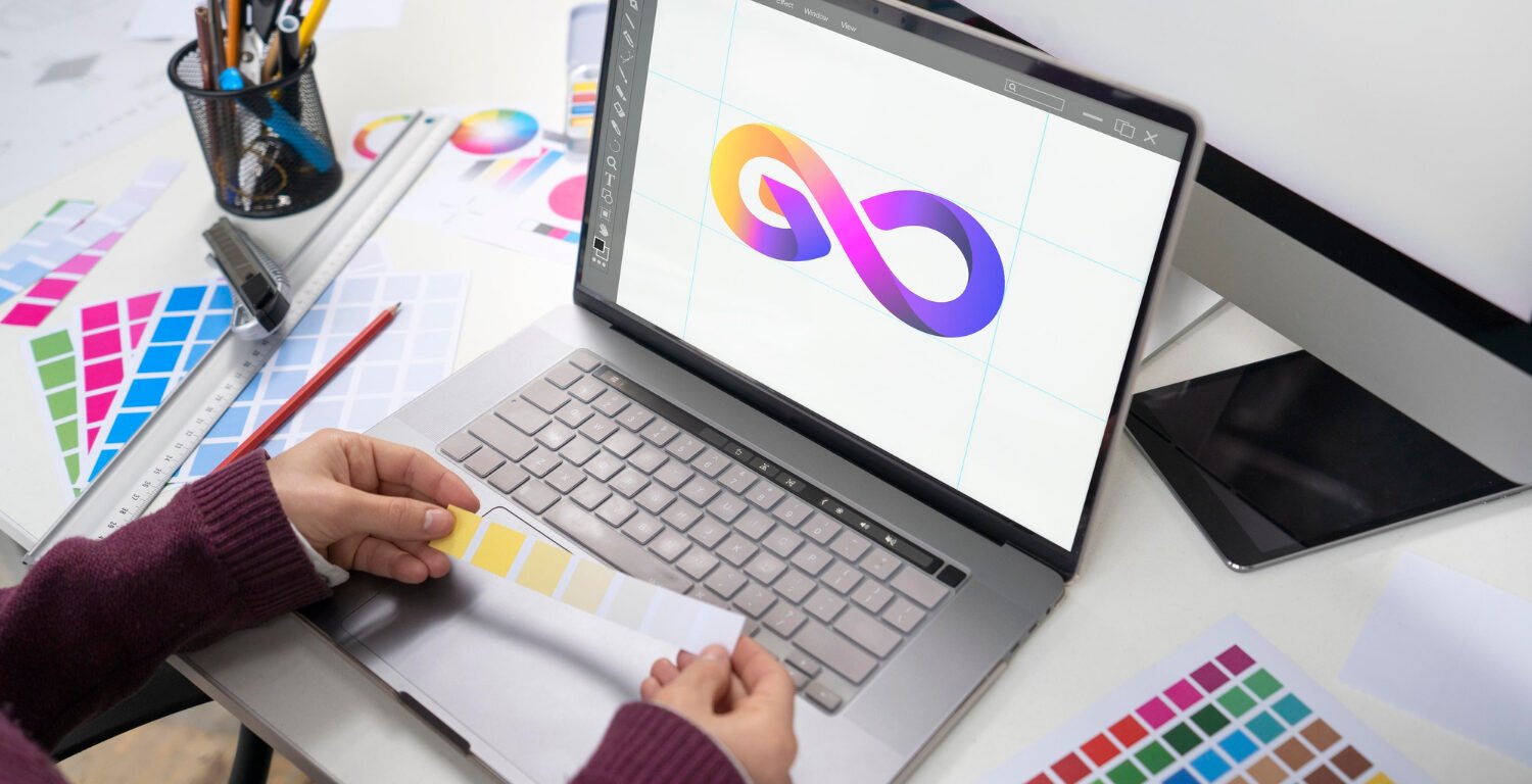female graphic designer working on her laptop