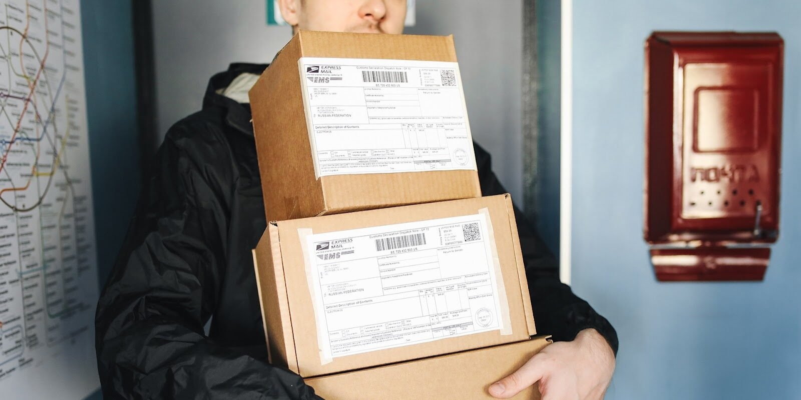 A man holding three delivery boxes - best small business ideas